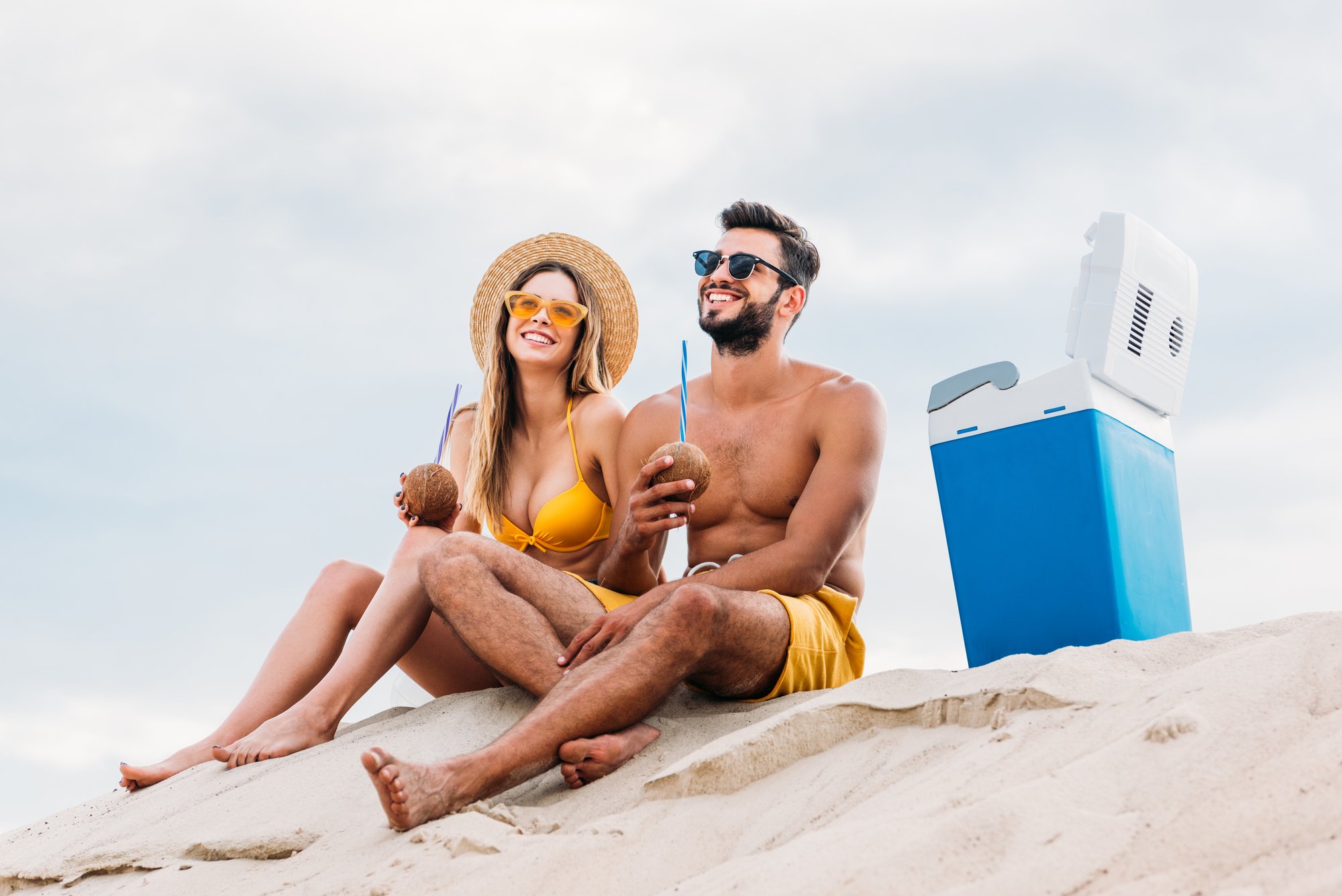 young couple at cloudy beach