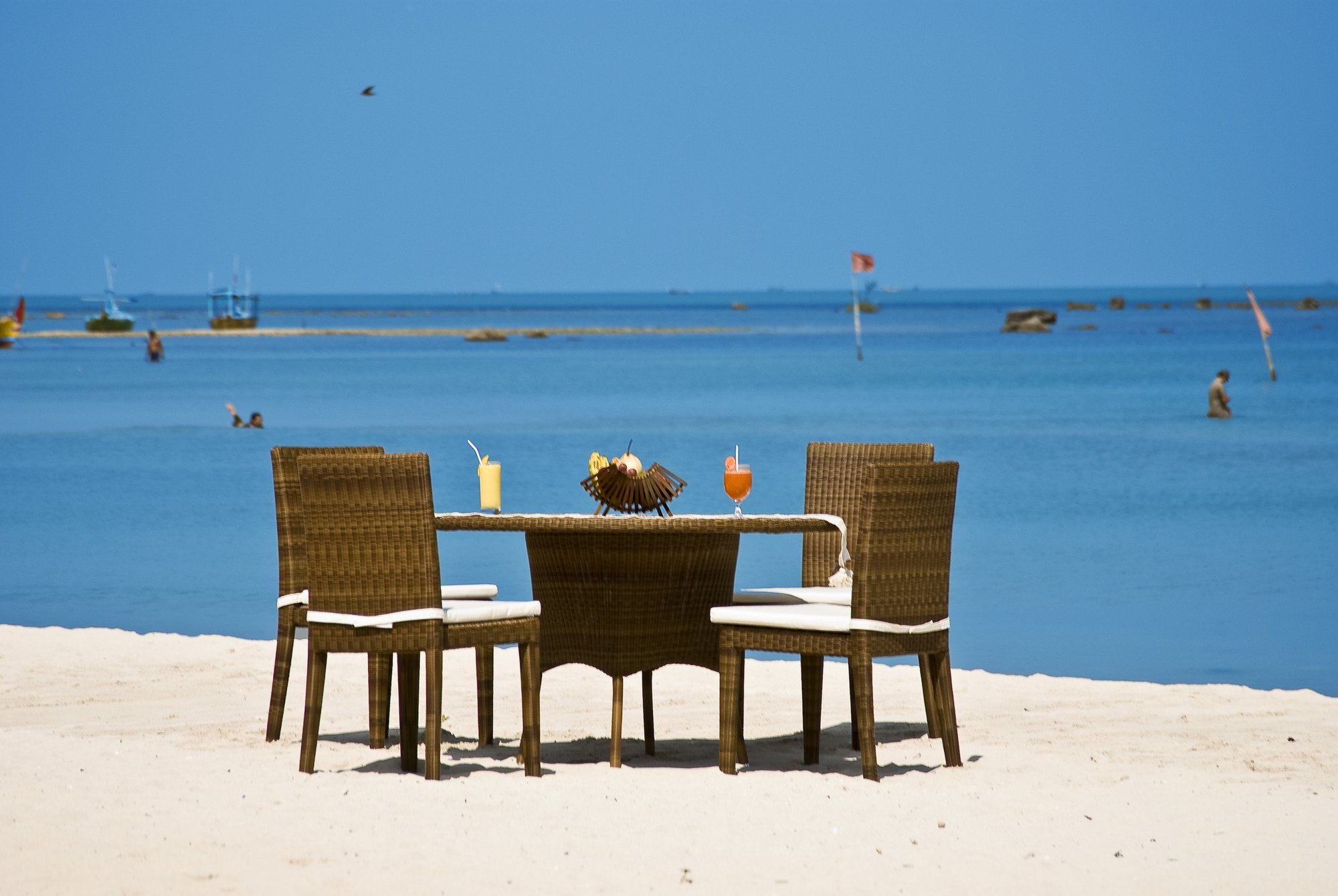 sandy beach with chair and table