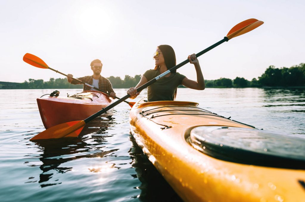 man and woman kayaking