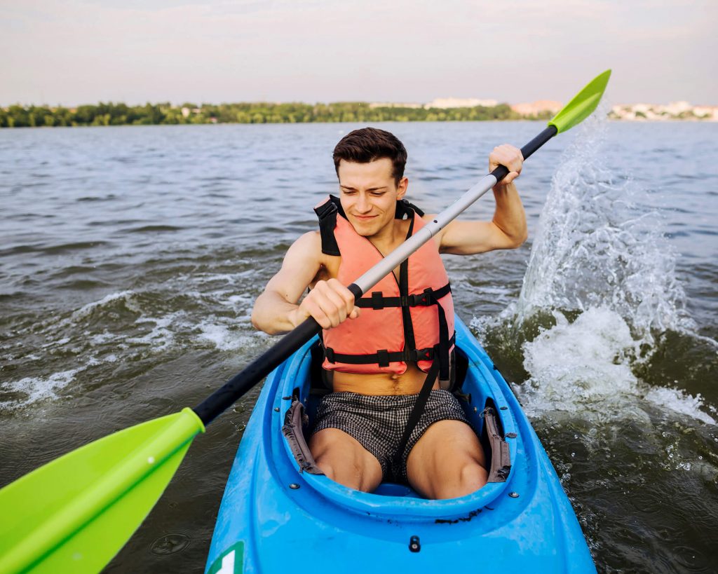 Man paddling in sit in kayak