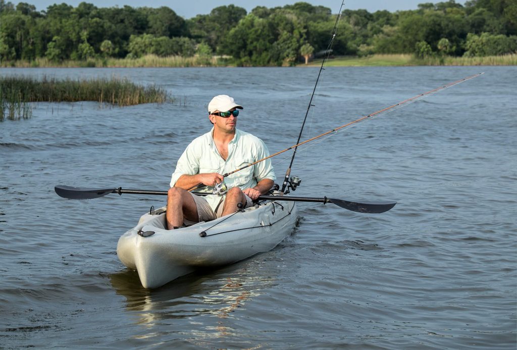 man fishing in kayak