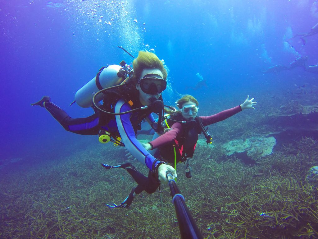 mother and daughter scuba diving in Maui