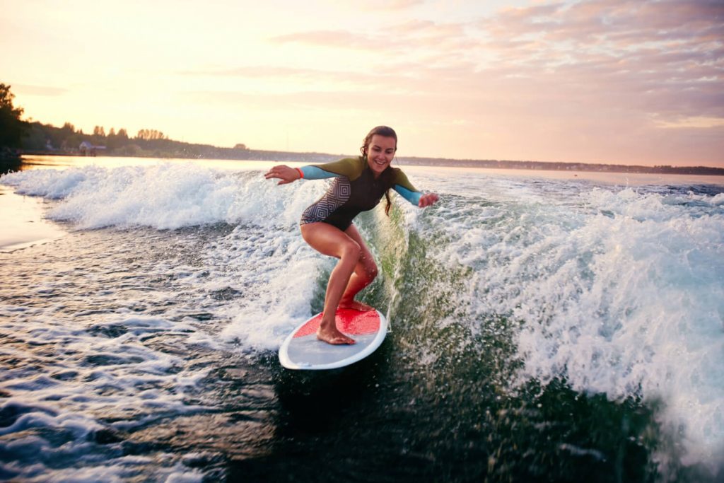 girl having fun surfing